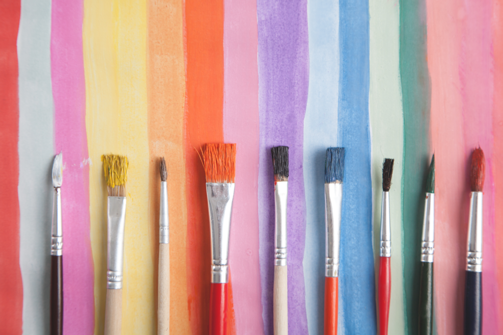 watercolor painting of stripes of different colors and paint brushes